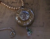 jewelry is like a tin of chocolate tabules you never know what you will make next vintage assemblage rhinestone pearl necklace coat  arms