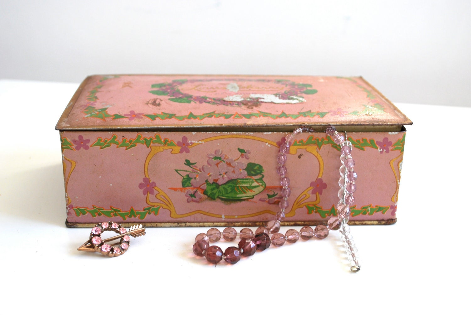 Dusky pink vintage tin box with art deco flowers, New York