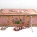 Dusky pink vintage tin box with art deco flowers, New York