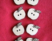 Laser Engraved Apple Buttons.