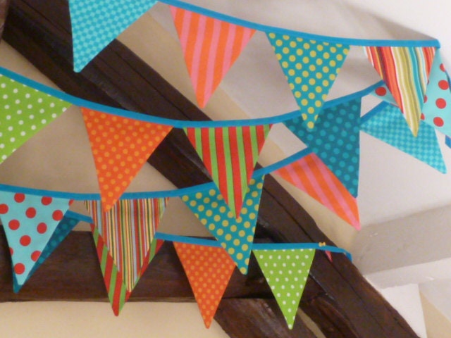 CARNIVAL fabric Bunting/Banner in KINGFISHER with Orange, Green, Red, Lime Geometric designs.