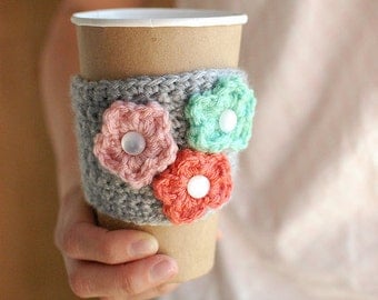 Coffee cozy with multi-colored flowers SPRINGPDX by The Cozy Project
