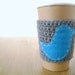 Coffee sleeve, gray with blue bird by The Cozy Project