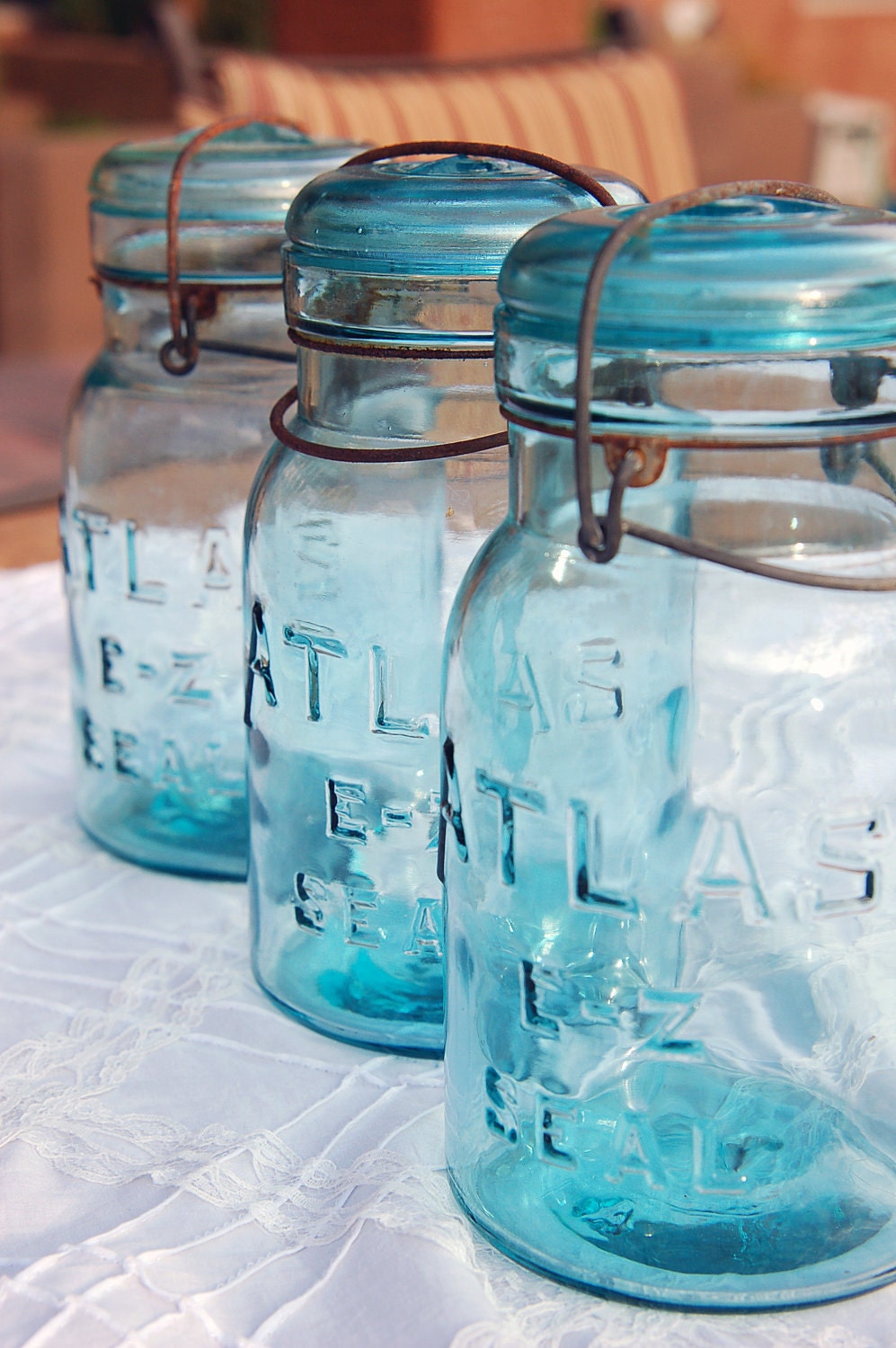 Three Atlas E-Z Seal Lightning Jars