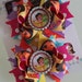 Dora pigtail bows -- Dora and Boots bottlecap bow -- lots of bright colors and polka dots-- for her Dora birthday