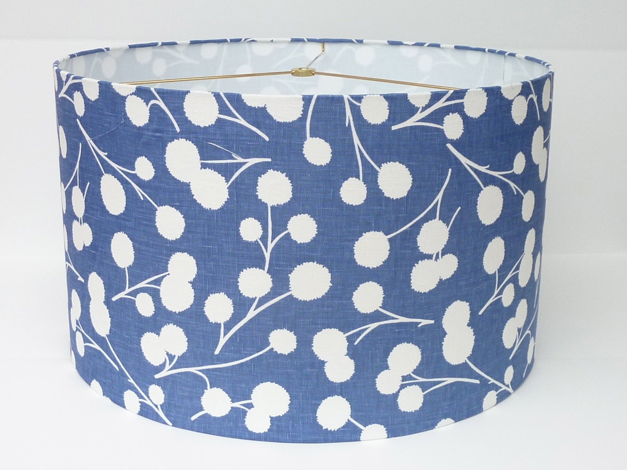 Drum lamp shade in a modern, fresh ink blue botanical print fabric by Thom Filicia