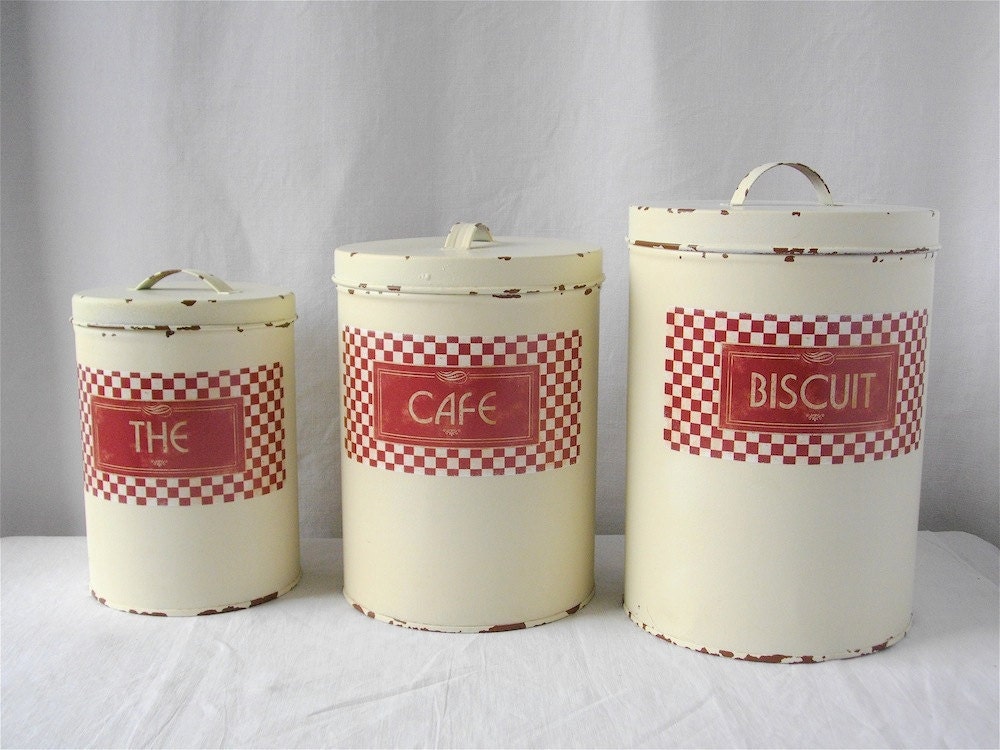Vintage French white metal canisters.