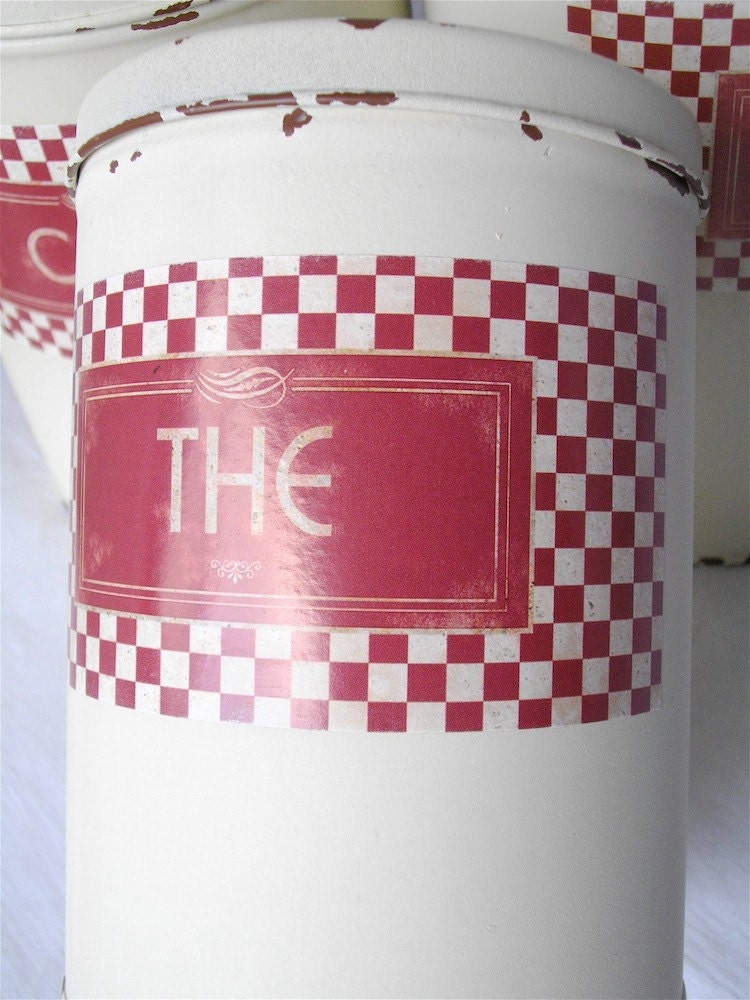 Vintage French white metal canisters.