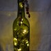 Hold for empresskara Wine Bottle Light Green Glass and clear lights with Amber and Brown colored beads