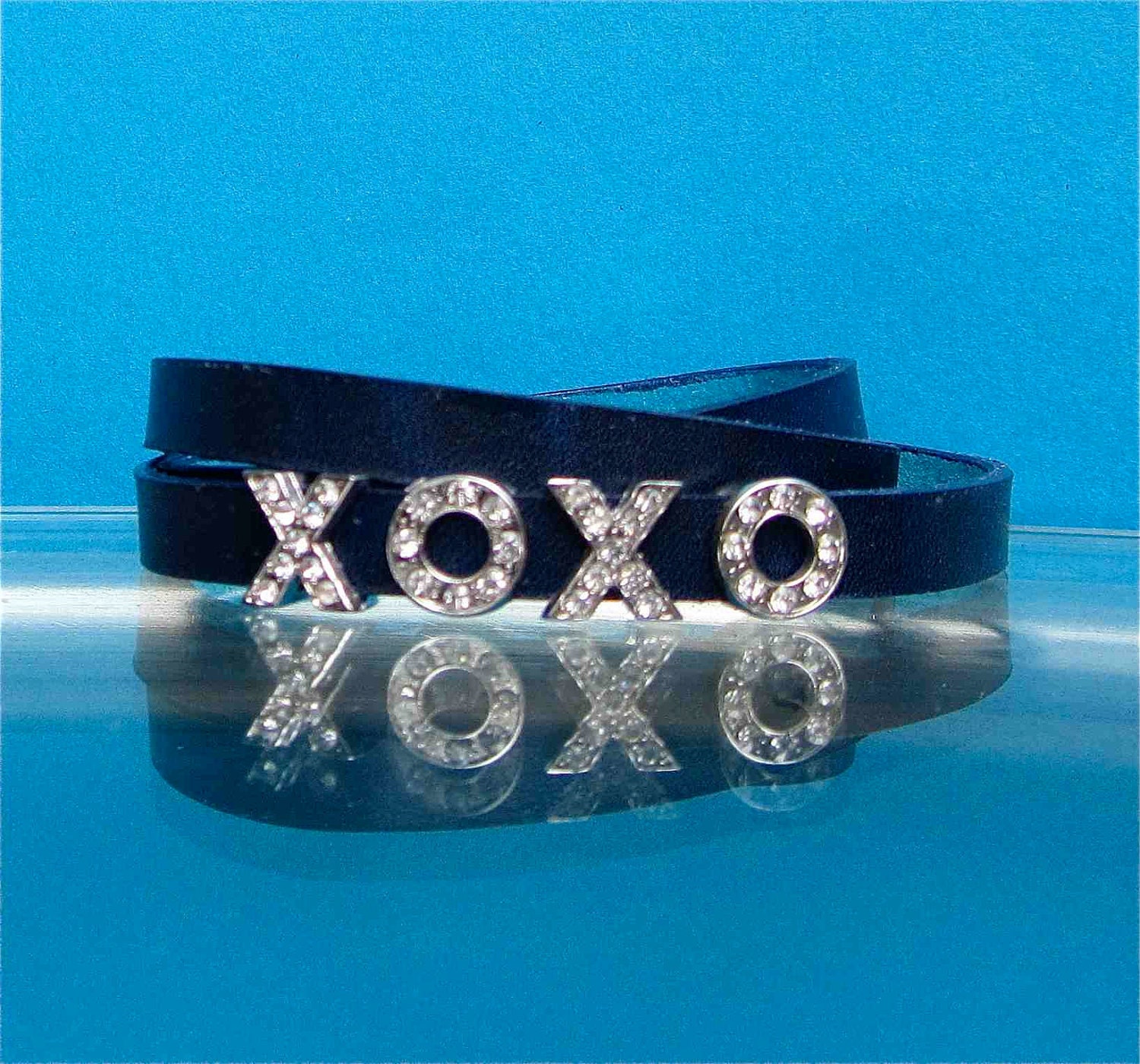 Leather wrap bracelet in dark blue eco tanned leather with crystal stones Hugs and Kisses charm. A perfect gift