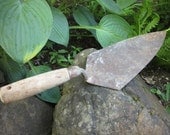 Trowel rusty vintage tile tool with wooden handle
