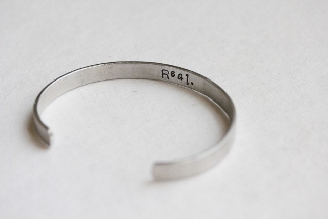 Hunger Games Real or Not Real hidden message cuff