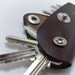 Extremely convenient keychain key holder from dark brown cowhide. Holds 6-8 regular keys, free monogramming , personalized/ belt hanger
