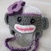 Purple trimmed sock monkey hat for baby (0-3 months)