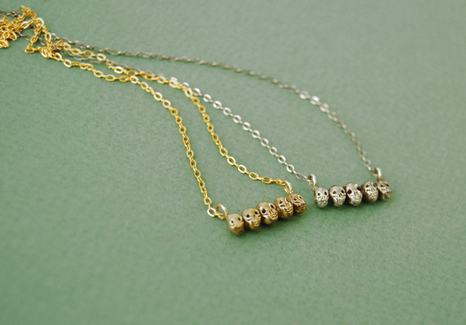 Tiny sterling silver skull necklace