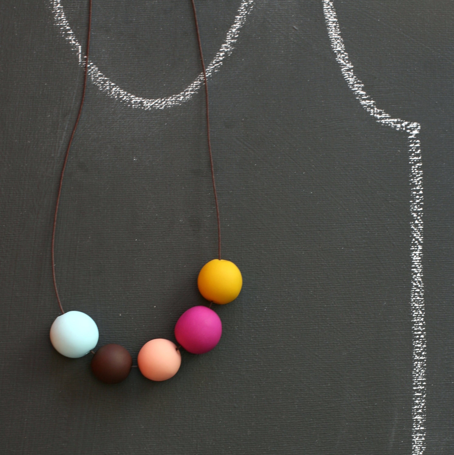 not quite round handmade beads make a necklace