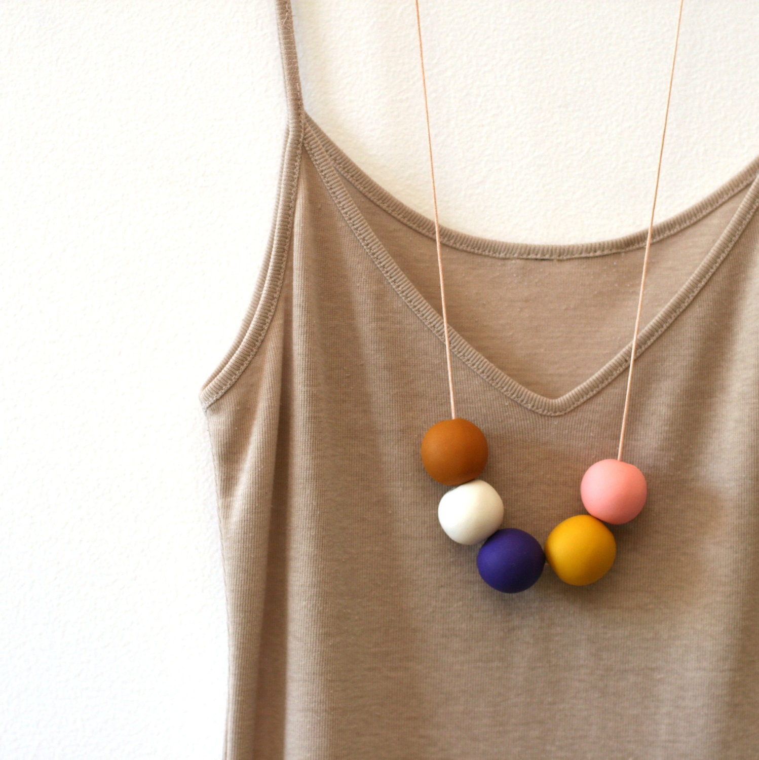 not quite round handmade beads make a necklace