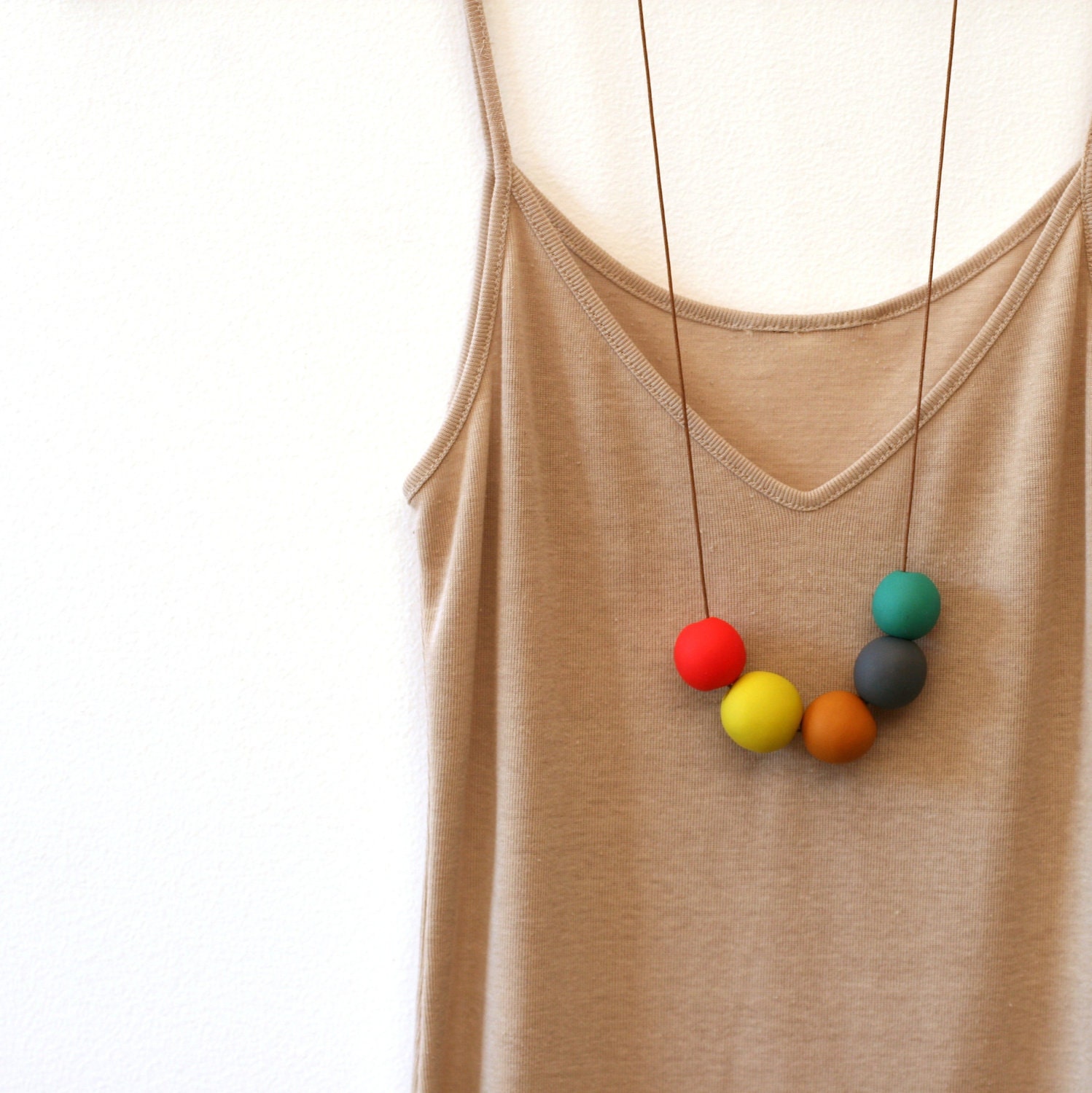 not quite round handmade beads make a necklace