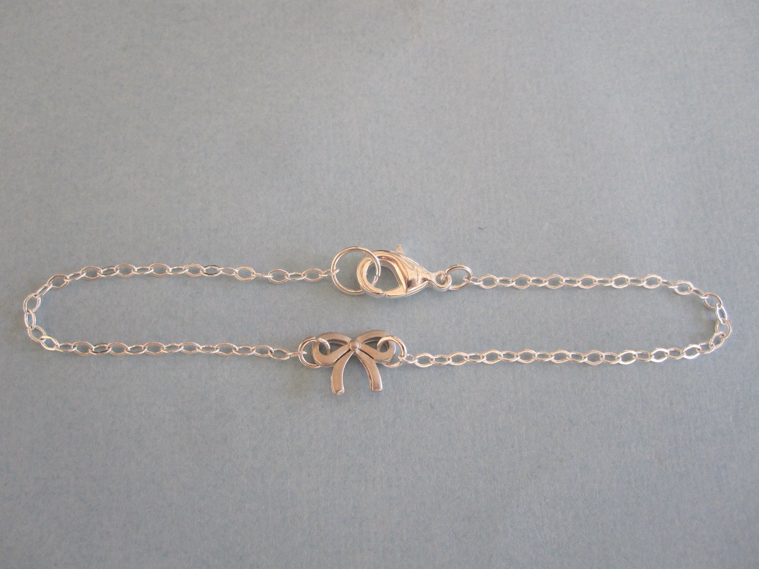 Tiny Bow Ribbon Bracelet available in gold or silver by MarisaLeeDesigns