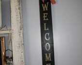 Welcome Sign with Stars and Red Checkered Ribbon
