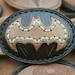 Brown leather and hemp Batman logo belt buckle, hand-tooled