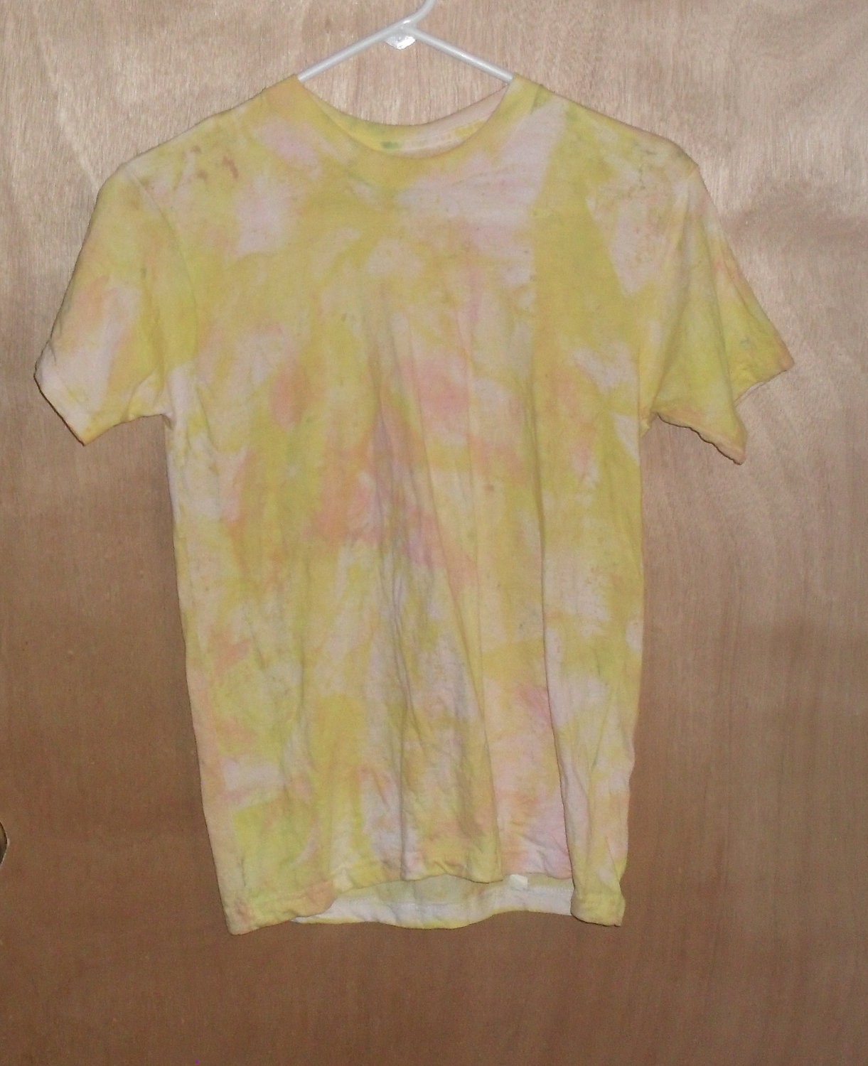 Youth Tie-dye Tshirt. Size 30-32. Unisex shirt. Green, yellow,peach, orange and white abstract design.