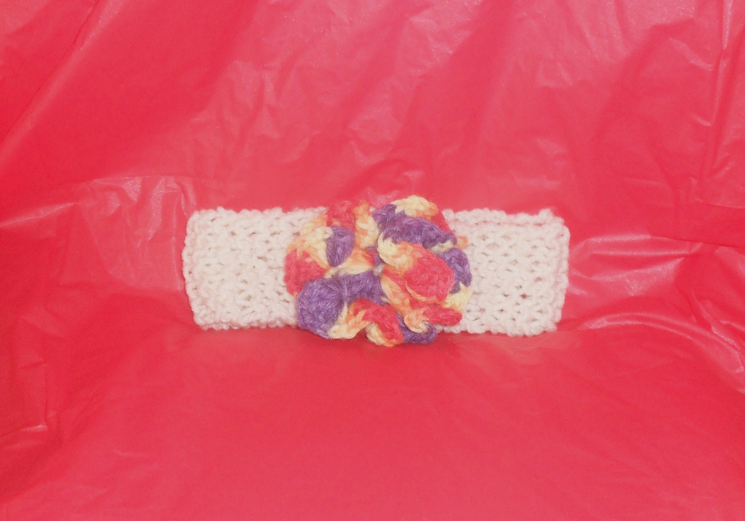 Lovely White Knitted Headband with a unique Multicolored flower