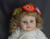 Lovely Multi Colored Knitted Headband with a 3 Unique Crocheted flowers.