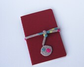 Moleskine Notebook with a multicolor crocheted ribbon