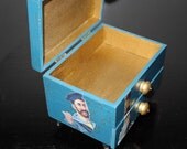 Nautical themed wood box with lid that opens for storage and one pull out drawer