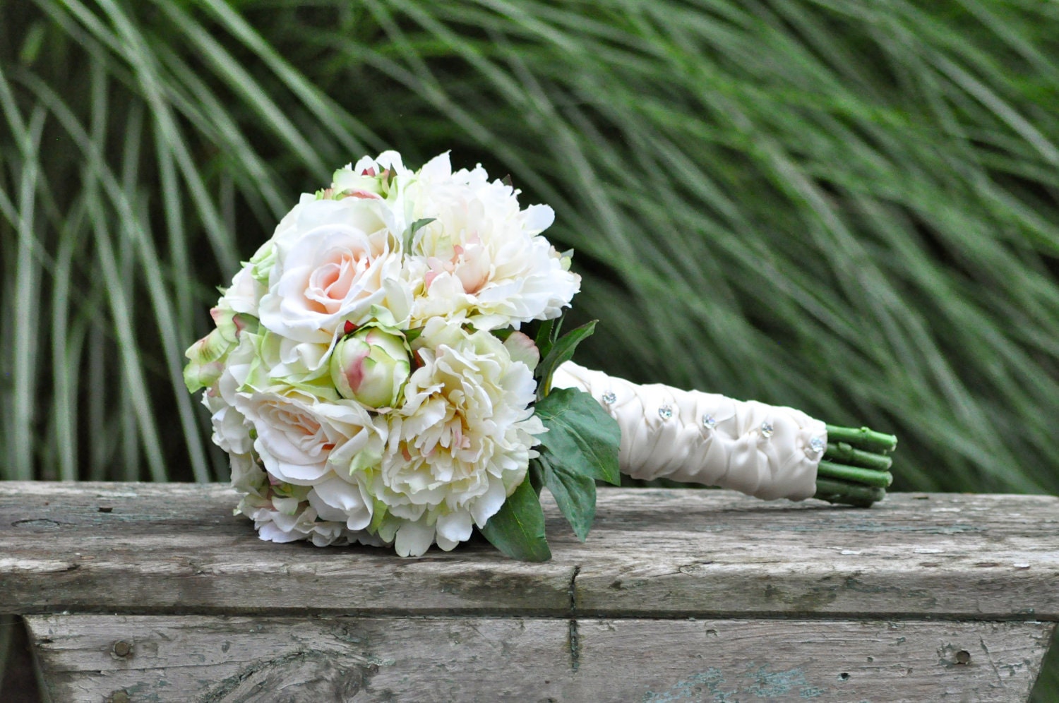 Blush rose and peony wedding bouquet made of silk flowers.