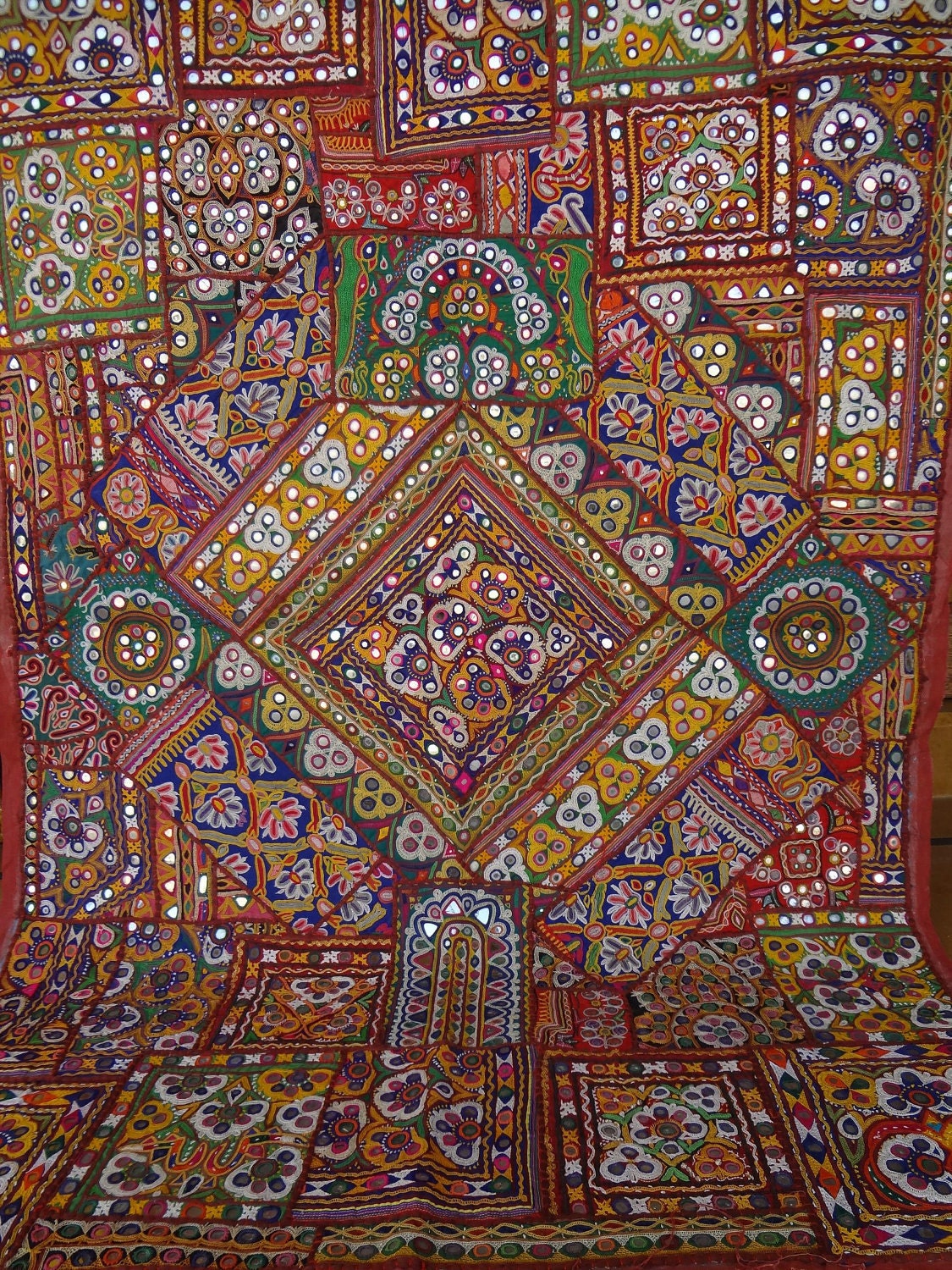 ethnic old textiles wall hanging made from old antique dresses patchwork from india tribes