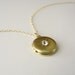 Small brass locket with crystal - small round locket on gold necklace - tiny locket