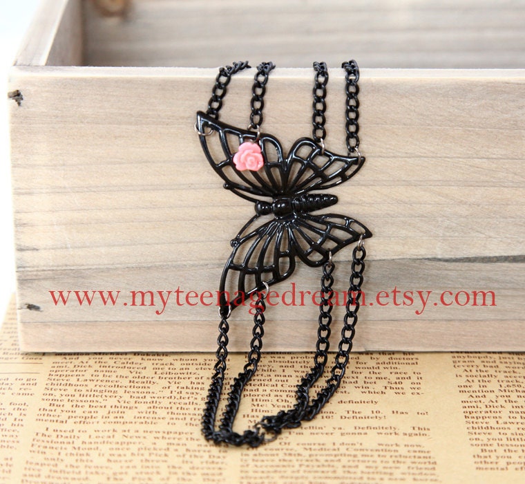 cool black butterfly bracelet, with a pink rose flower
