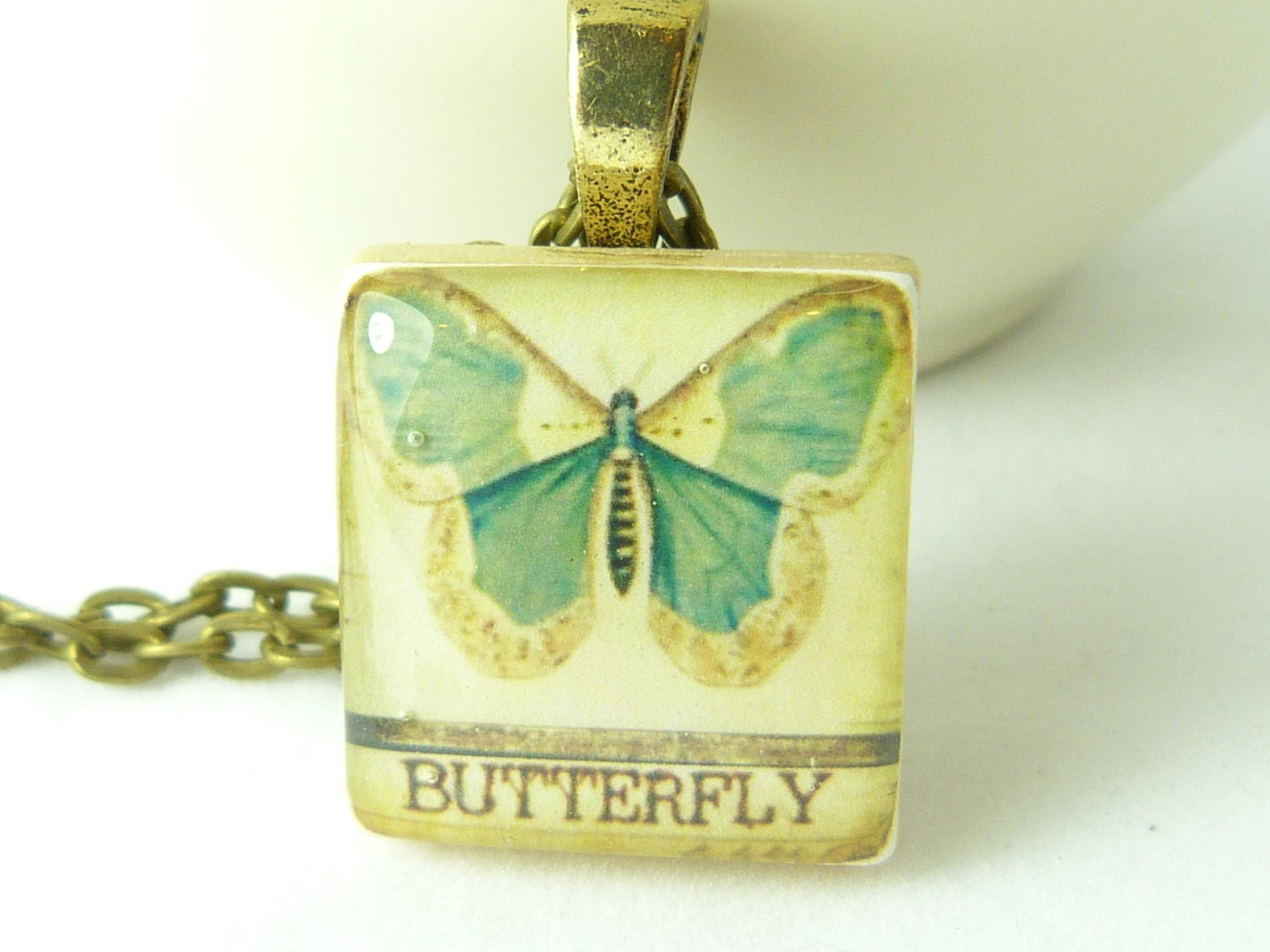 Scrabble tile pendant necklace - blue butterfly - 24 in antique brass necklace.