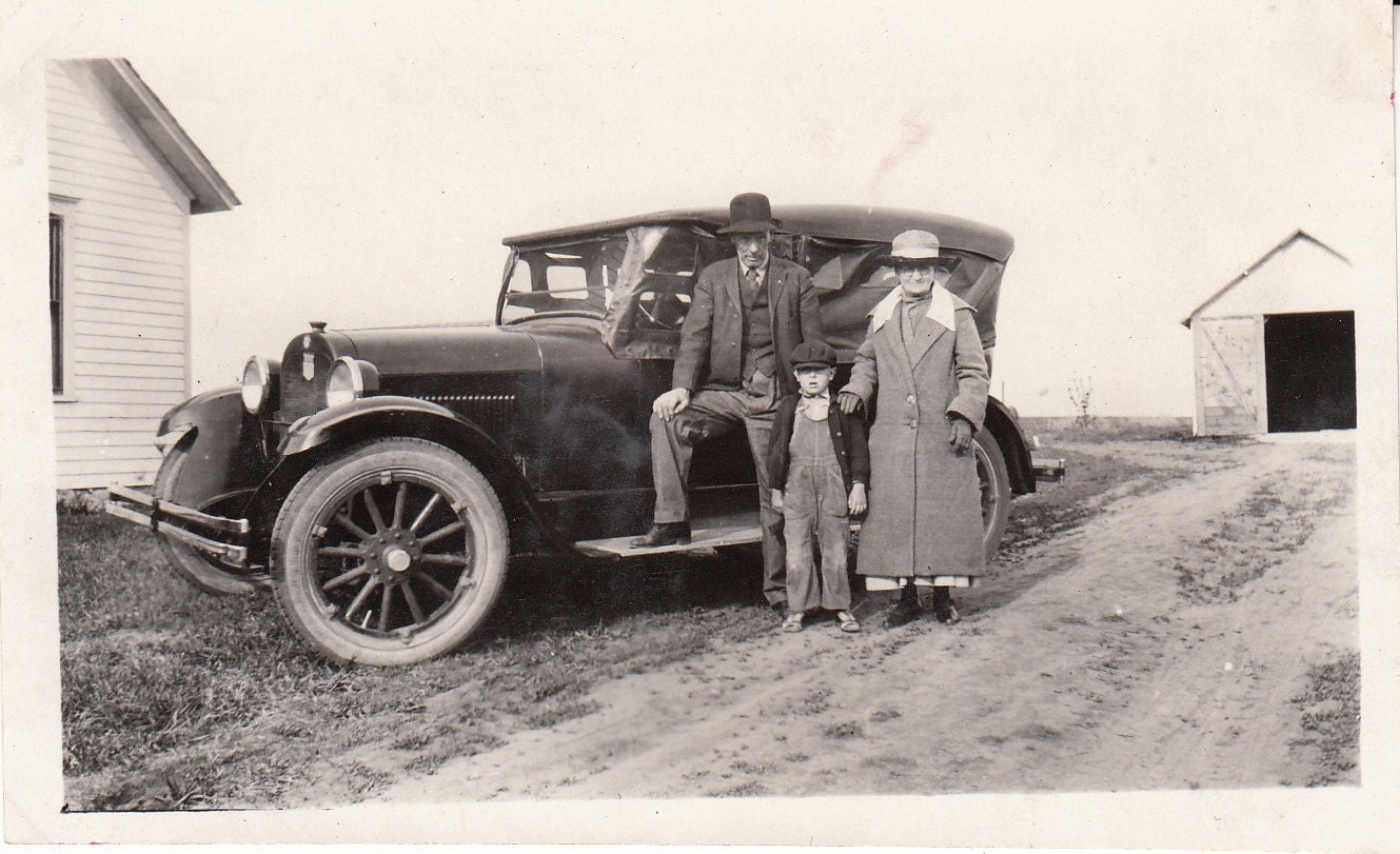 Vintage/Antique photo of  grandparents, grandson and their vintage car