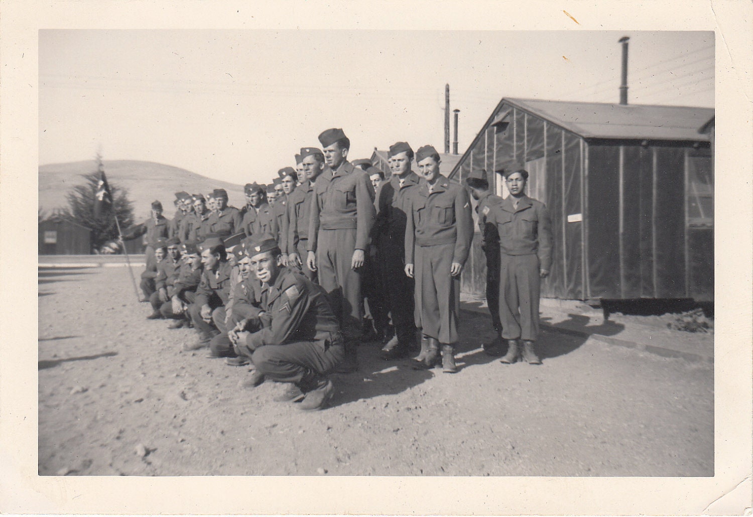 Vintage/Antique photo of a gathering of men in a military uniform