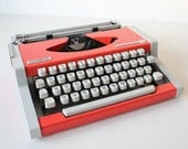 Vintage  1970s Olympia Traveller de Luxe Portable Manual Typewriter in Retro Orange/Red color
