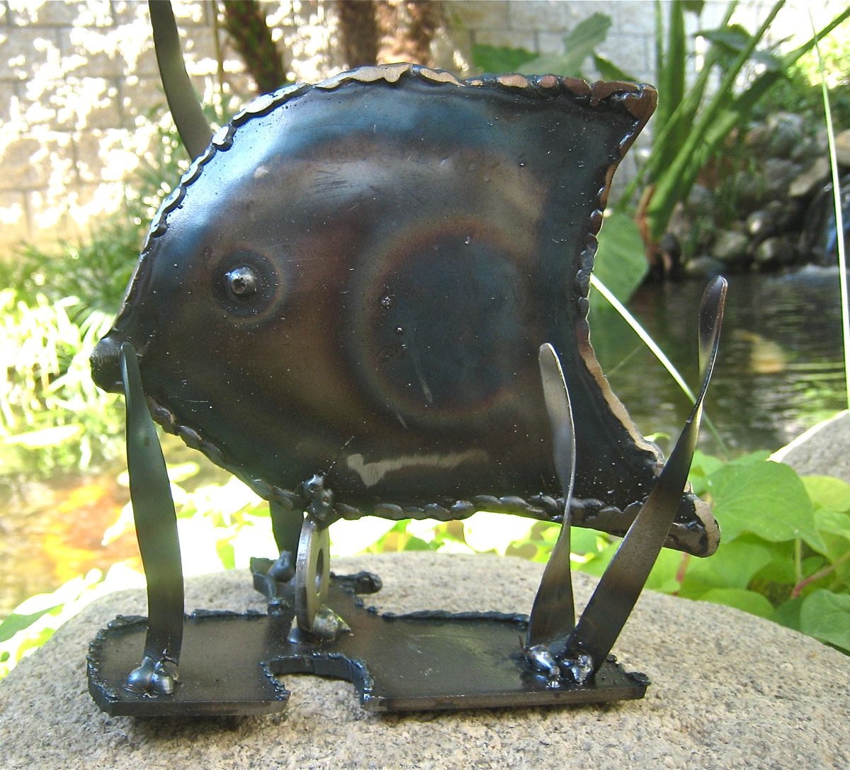 Tommy the Tang fish Metal art sculpture        He's rustic OOAK unique and he has lots of relatives waiting to be adopted
