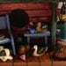 Log Cabin Birdhouse - Fishing & Hunting Camp with duck decoys, creel, dog and stone chimney