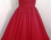 A beautiful red one strap 50s style cocktail dress. Made to measure available. Any size welcome.
