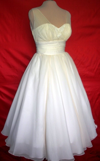 A beautifully elegant off-white 50s inspired wedding dress