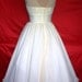 A beautifully elegant off-white 50s inspired wedding dress