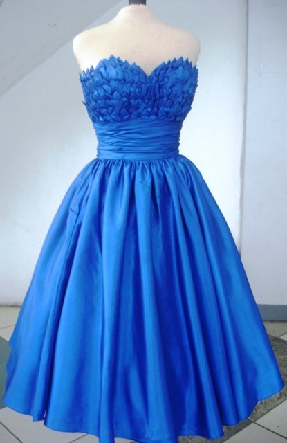 Alluring intricate, 50s inspired ball dress with beautiful bust detail inspired by blooming petals