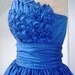 Alluring intricate, 50s inspired ball dress with beautiful bust detail inspired by blooming petals