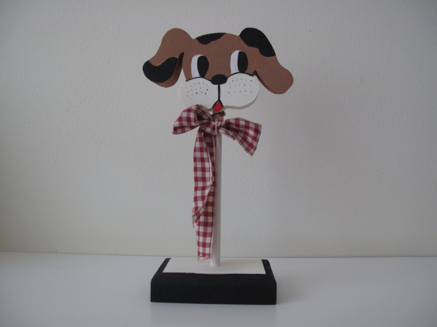 Wood dog with bow