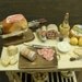 Miniature table  shabby chic set up with salami and typical Italian products