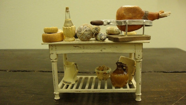 Miniature table  shabby chic set up with salami and typical Italian products