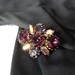 RESERVED - 1940s French brooch with amethyst tone and aurora borealis stones