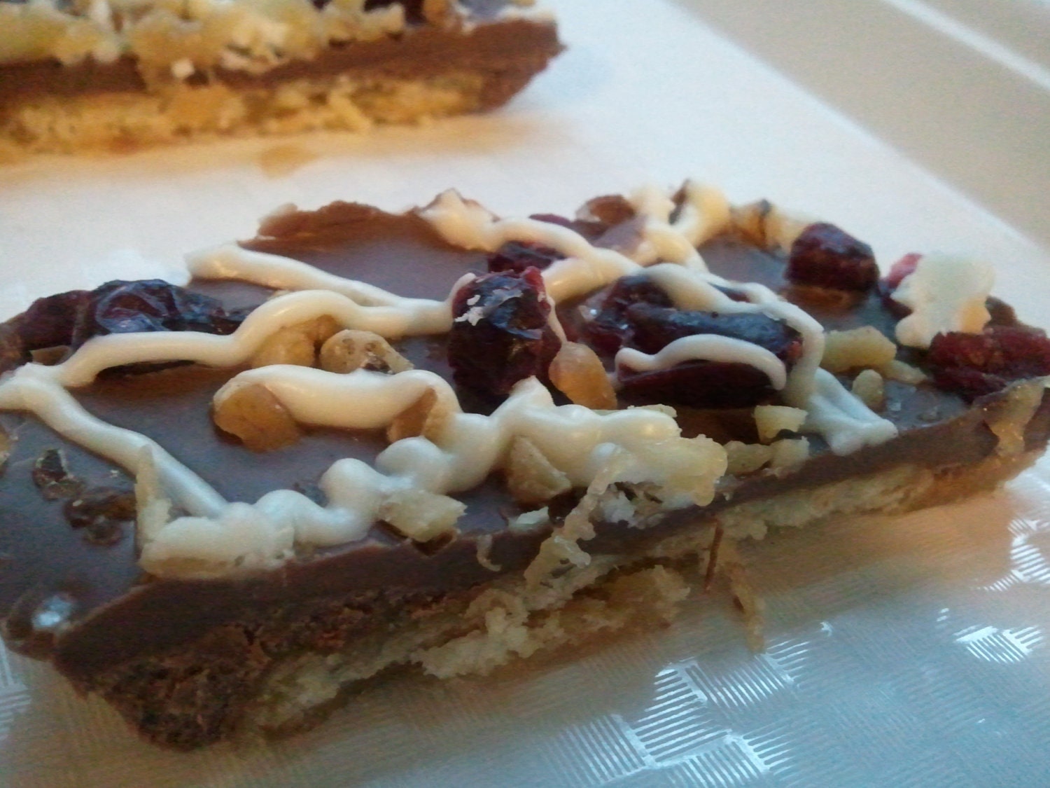 Sweet and Salty Semi-Sweet & Milk Chocolate Cranberry Walnut Toffee Butter Cracker Candy With White Chocolate drizzle(1/2 lb)